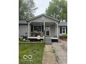Charming single-story home with gray siding and welcoming front porch at 7504 N Green Meadows, Fairland, IN 46126