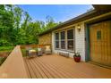 Exterior side view of deck with chairs and table outside the front door at 8000 Mcwhorter Rd, Martinsville, IN 46151