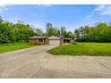 Charming single story house with a well-maintained lawn and an attached two-car garage at 8000 Mcwhorter Rd, Martinsville, IN 46151
