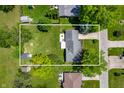 Aerial view of property with a well-maintained lawn and mature trees at 9104 W Lone Beech Dr, Muncie, IN 47304