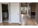 Open entryway showcasing wood flooring, neutral paint, and access to other rooms and living spaces at 11754 Hamble Dr, Indianapolis, IN 46235