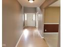 Bright entryway showcasing neutral paint, wood flooring, a white front door and foyer with natural lighting at 11754 Hamble Dr, Indianapolis, IN 46235