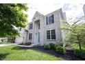 Stunning two-story home featuring a well-maintained lawn, mature trees, and meticulous landscaping for a picturesque curb appeal at 12093 Ashland Dr, Fishers, IN 46037