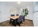 Bright dining room with wooden floors, modern chairs, table and natural light at 13896 Fernleaf Way, Carmel, IN 46033
