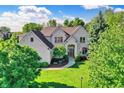 Beautiful home featuring a well-kept lawn, professional landscaping, and classic brick exterior at 16316 Brookhollow Dr, Westfield, IN 46074