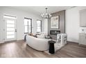 Bright living room with modern fireplace, wood floors, and stylish decor at 17339 Newton Main St, Westfield, IN 46074