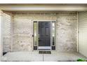Welcoming front entry with a black front door framed by sidelights and a brick facade at 197 Ceejay Dr, Greenwood, IN 46142