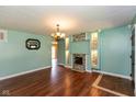 Bright living room with hardwood floors, stone fireplace, and recessed lighting at 2519 N Boehning St, Indianapolis, IN 46219