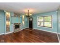 Inviting living room features a modern fireplace, hardwood floors, and a bright window at 2519 N Boehning St, Indianapolis, IN 46219