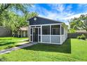 Charming home with a quaint front porch with a well manicured lawn at 2936 N Gladstone Ave, Indianapolis, IN 46218