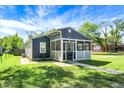 Charming home with a quaint front porch and lush green lawn at 2936 N Gladstone Ave, Indianapolis, IN 46218