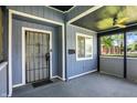 Comfortable enclosed front porch featuring a storm door and ceiling fan at 2936 N Gladstone Ave, Indianapolis, IN 46218