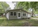 Cozy one-story home with tidy landscaping, neutral siding, and an attached single-car garage at 521 Elmhurst Pl, Whiteland, IN 46184