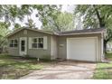 Single-story home featuring neutral siding, a one-car garage, and a simple, cozy design at 521 Elmhurst Pl, Whiteland, IN 46184
