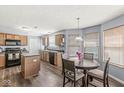 Spacious eat-in kitchen with wood cabinets, stainless steel appliances, and modern finishes. Ready for entertaining at 5671 Glass Chimney Ln, Indianapolis, IN 46235
