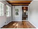Bright room with hardwood floors and views through an open doorway at 6264 Central Ave, Indianapolis, IN 46220