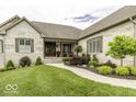 Beautiful brick home with landscaped front yard and welcoming walkway leading to the entrance at 7648 Killarney Dr, Indianapolis, IN 46217