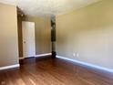 Entry way with wood flooring and neutral-toned walls leading into adjacent spaces at 7824 Hearthstone Way, Indianapolis, IN 46227