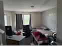Comfortable living room with a large window, and carpeted floors at 10803 Gathering Dr, Indianapolis, IN 46259