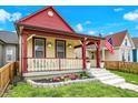 Inviting home featuring a cozy front porch and a well-kept yard at 1333 Spann Ave, Indianapolis, IN 46203