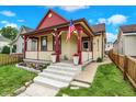 Charming home with a welcoming front porch, American flag, and well-maintained yard at 1333 Spann Ave, Indianapolis, IN 46203