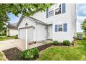 Well-maintained two-story home boasts a spacious two-car garage at 15411 Wandering Way, Noblesville, IN 46060