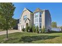 Lovely two-story home with well-manicured lawn and beautiful mature tree at 1664 Woodside Cir, Franklin, IN 46131