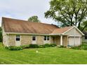 Charming home featuring a stone facade, attached two-car garage, and beautiful lawn at 18906 Crestview Ct, Westfield, IN 46074