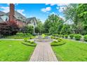 Lush green lawn and landscaping surround the home with a brick walkway at 20170 Starlight Ct, Noblesville, IN 46062