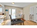 Light-filled dining area with a modern table, seating for six, and hardwood floors at 249 Spring St, Plainfield, IN 46168