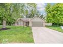 Charming one-story home with a brick facade, attached garage, and a well-manicured lawn at 3898 Chelsea Ter, Greenwood, IN 46143