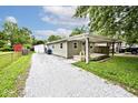 Charming one story home with covered front porch and gravel driveway at 4910 W Caven St, Indianapolis, IN 46241