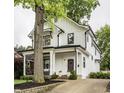 Beautifully landscaped home boasting modern design and a covered front porch at 5254 N Park Ave, Indianapolis, IN 46220