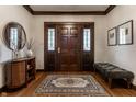 Elegant foyer featuring a decorative rug, wood floors, and stylish furnishings at 5430 N Washington Blvd, Indianapolis, IN 46220