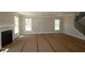 Bright living room with a fireplace, large windows, and neutral tones, awaiting personalization and decor at 5517 Sienna Ct, Brownsburg, IN 46112