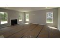 Spacious living room with a fireplace awaiting customization and flooring at 5517 Sienna Ct, Brownsburg, IN 46112