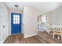 Bright foyer with light wood floors and a view into the kitchen at 6789 Passage Cir, Indianapolis, IN 46250