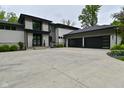 Beautiful home featuring a spacious driveway and a three-car garage at 7070 Dean Rd, Indianapolis, IN 46220