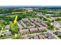 Aerial view of townhouses near the Monon Trail in a lush, green landscape at 73 11Th Nw St, Carmel, IN 46032