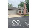 The property showcases a well-maintained exterior with a two-car garage and mature landscaping at 811 Gazebo Way, Greenwood, IN 46142