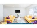 Bright living room features sleek, modern furnishings and hardwood floors at 8744 Montery Ct, Indianapolis, IN 46226