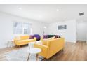 Bright living room features sleek, modern furnishings and hardwood floors at 8744 Montery Ct, Indianapolis, IN 46226