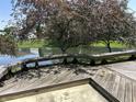 Outdoor deck overlooking a tranquil pond, perfect for relaxation and entertaining in a serene setting at 11014 Lake Run Dr, Fishers, IN 46038
