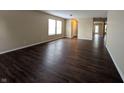 Spacious living room featuring wood floors and a view to the hallway and entry at 11343 Congaree Way, Indianapolis, IN 46235