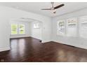 Inviting living room showcasing hardwood floors, arched doorway, and bright windows at 1209 W 22Nd St, Anderson, IN 46016