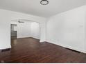 Spacious living room featuring hardwood floors and an arched entryway at 1209 W 22Nd St, Anderson, IN 46016