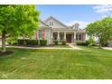 Beautiful home featuring stone accents, dormer windows and professionally landscaped lawn at 15292 Slateford Rd, Noblesville, IN 46062
