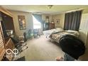 Cozy bedroom with carpet, a double bed, curtains, and ample space for storage and relaxation at 162 N Gladstone Ave, Columbus, IN 47201
