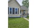 Inviting single-story home with a covered front porch, neat lawn, and sidewalk entry at 179 E Pearl St, Greenwood, IN 46143