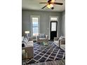 Comfortable living room with modern furniture, a patterned rug, and neutral color scheme at 179 E Pearl St, Greenwood, IN 46143